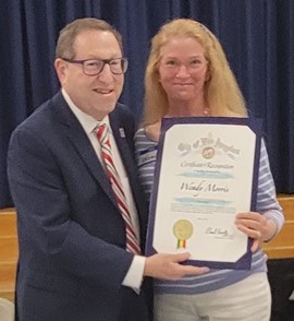 Wendy receiving a certificate